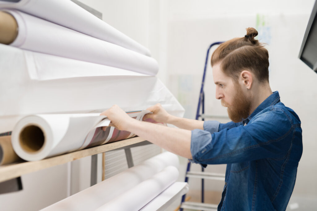 Hipster printing photos house employee